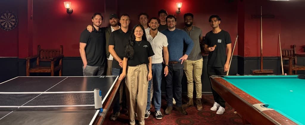 The team at a pool and ping-pong game night